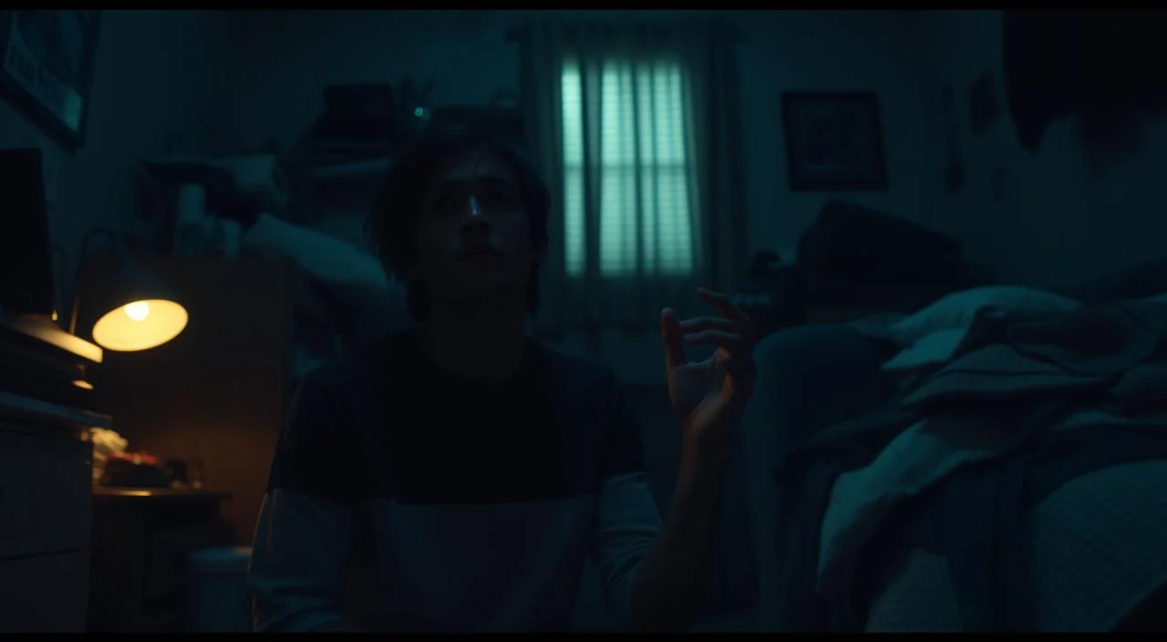 A person sitting anxiously in a dimly lit room, their face partially obscured by shadows, as they struggle with the overwhelming impact of their thunderstorm phobia on their daily routine. The room is cluttered with objects, reflecting the disorganized state of their mind. Muted colors and a sense of unease permeate the scene, conveying the profound disruption this phobia causes in their life. The lighting is low-key, creating a somber and introspective atmosphere. The camera angle is slightly tilted, adding a sense of unease and imbalance to the composition.